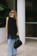 sleeveless black fringed top